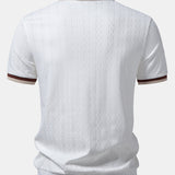 Polo homme texturé à col zippé contrasté