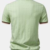 Polo homme texturé à col zippé contrasté