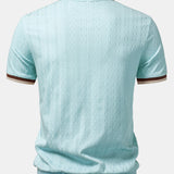 Polo homme texturé à col zippé contrasté